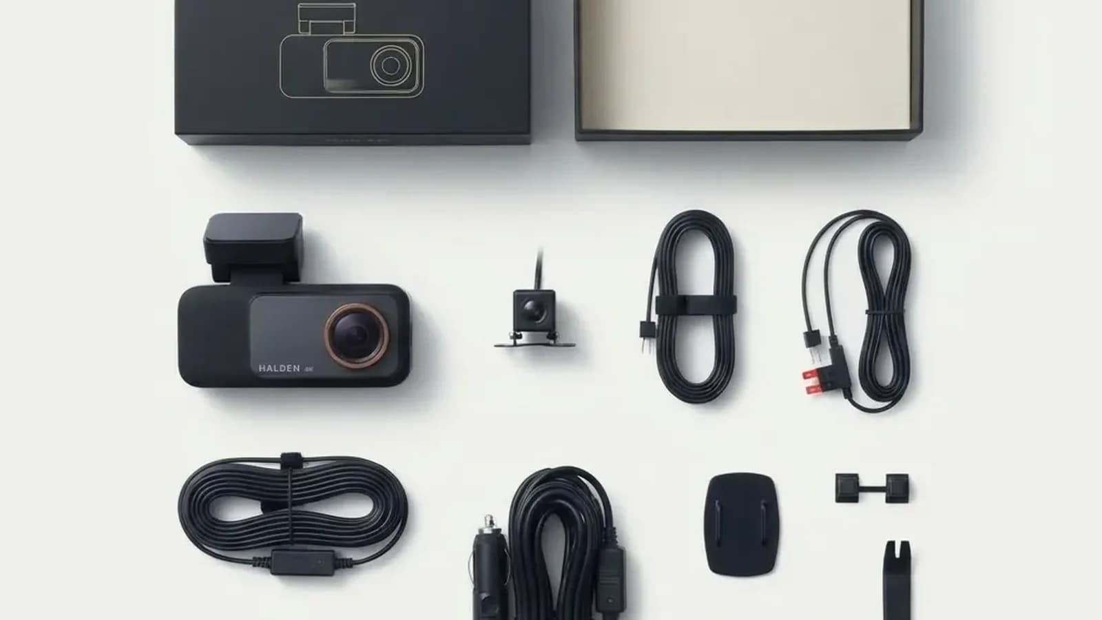 Everything in the Halden box laid out: the dash cam, rear camera, rear cable, wiring kit, car charger cable, mount, clips and trim tool