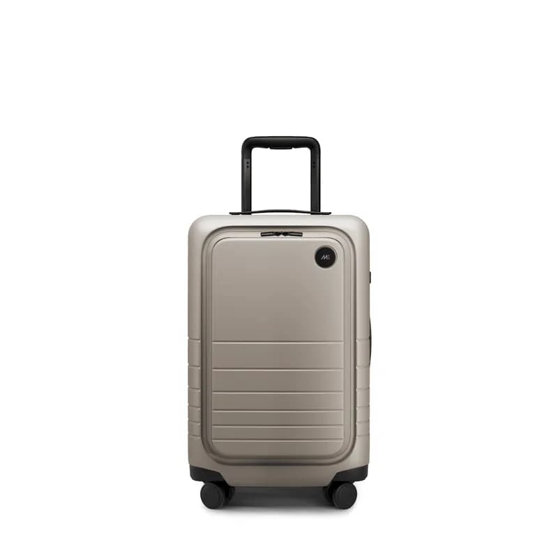 Monos Carry-On Pro hard-shell suitcase with front laptop pocket in taupe